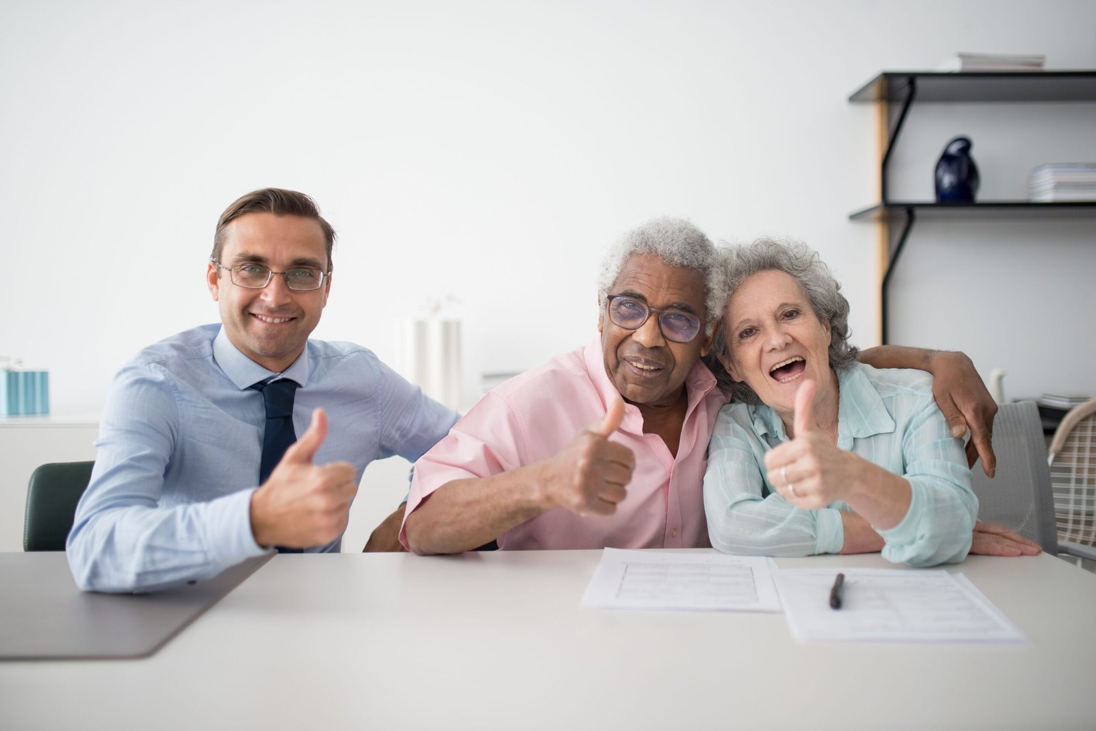 Senior couple meeting a real estate professional about a home transition