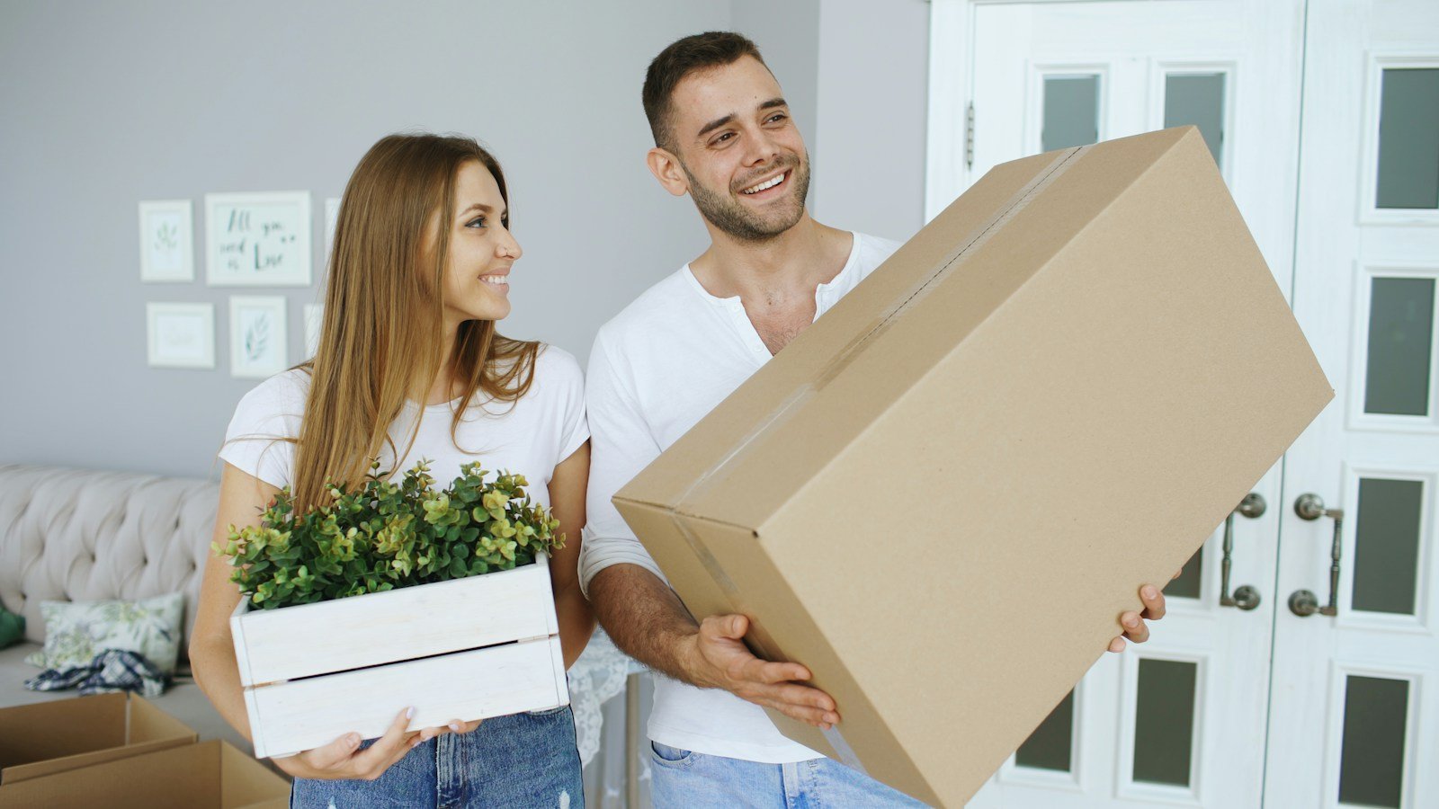 Older couple with moving boxes while downsizing to a new home in Georgia