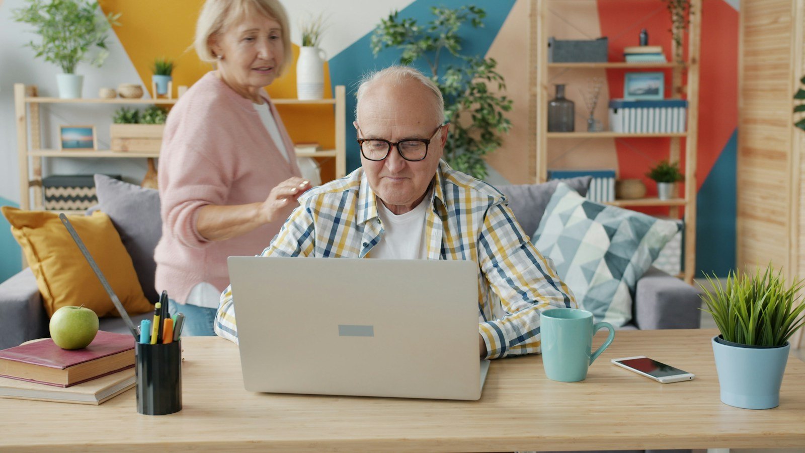 Retired Georgia couple reviewing final expense insurance costs together at home