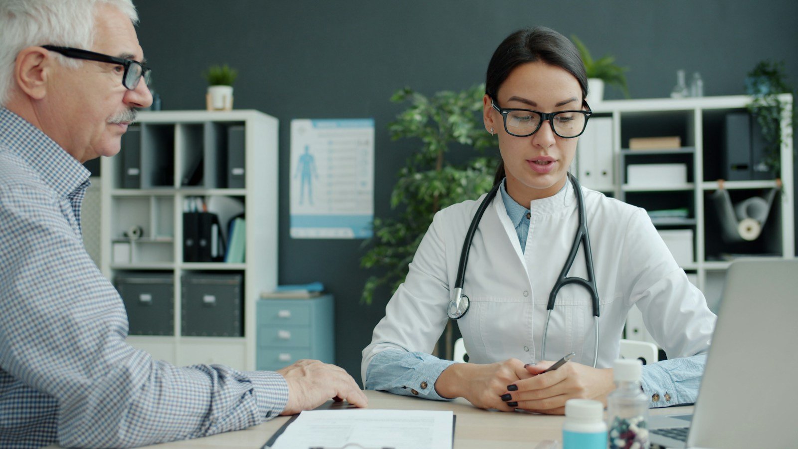 Doctor talking with an older patient, the kind of medical visit Medicare Part B covers