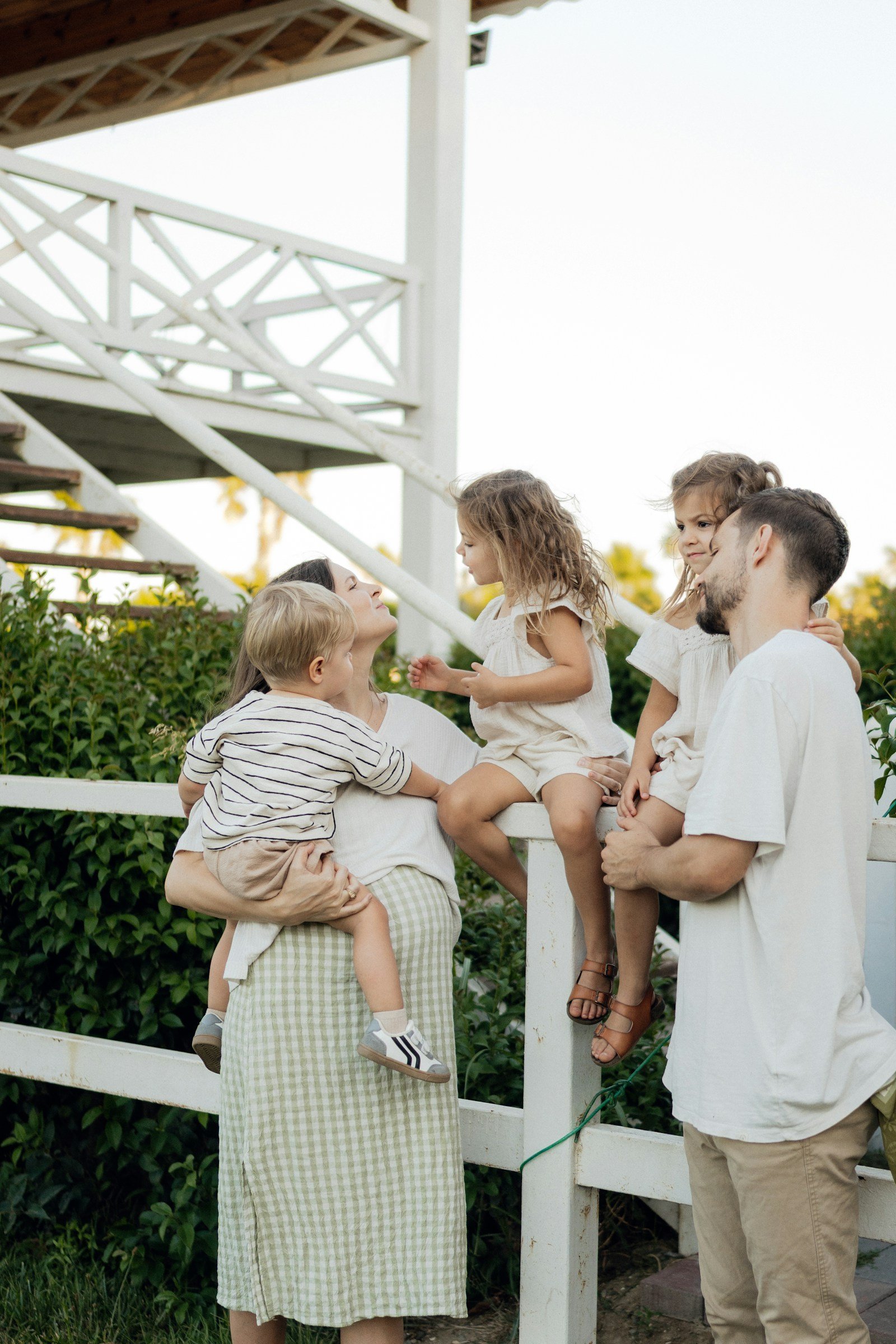 Family together on a porch, the kind of loved ones term life insurance protects
