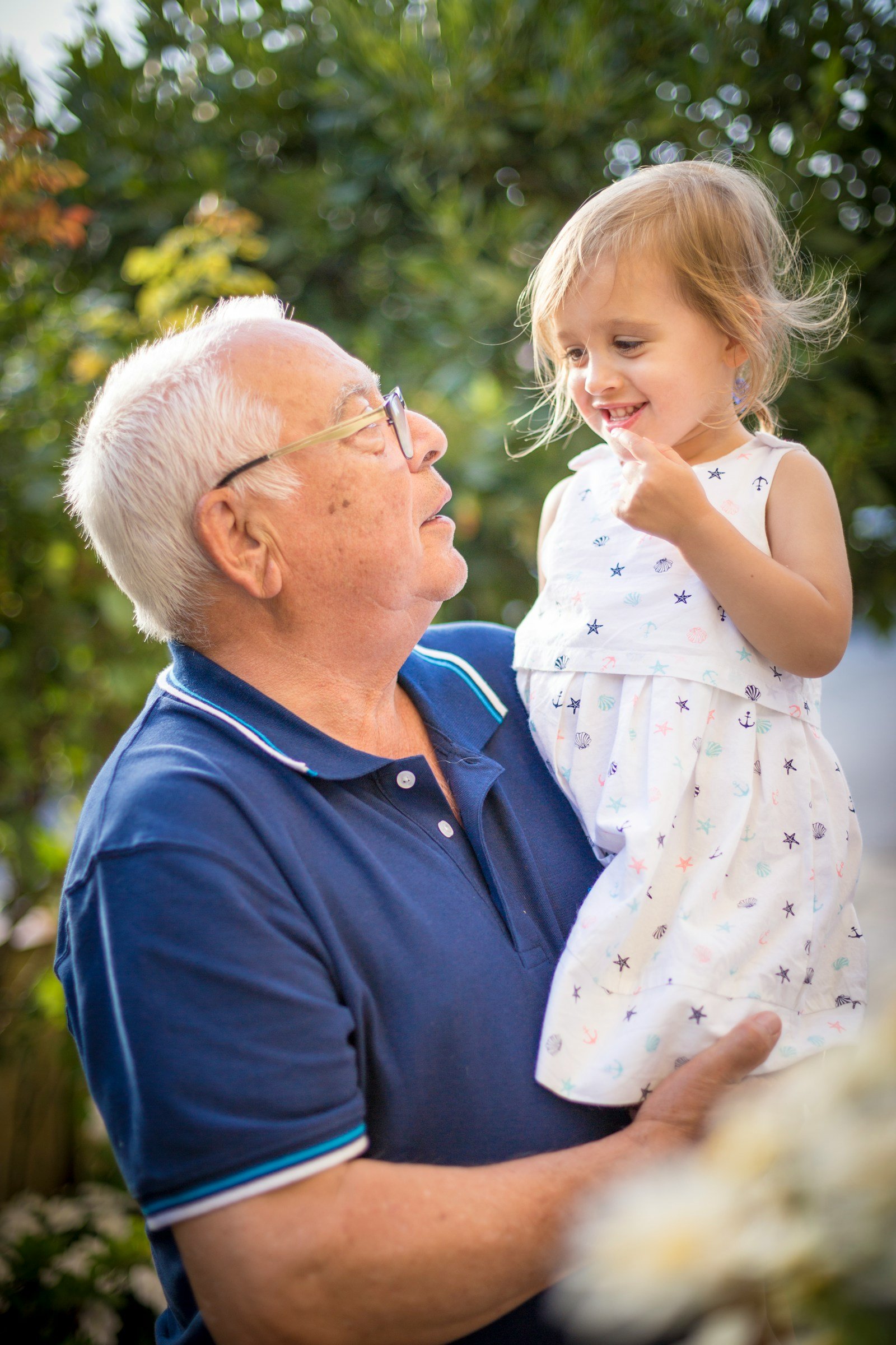 Grandfather and granddaughter together, reflecting the lifelong protection whole life insurance provides