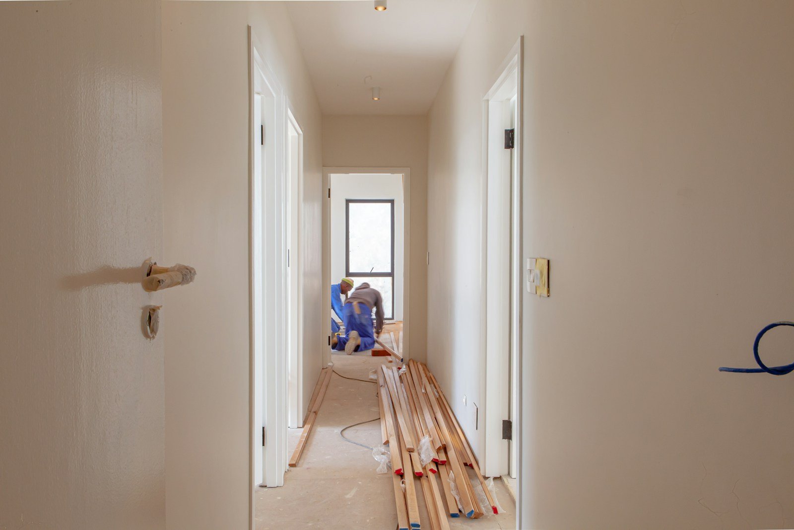 Workers renovating a house, the kind of project a fix and flip loan funds