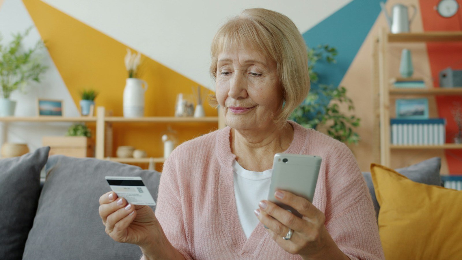 Senior managing finances at home, reflecting the help a Medicare Savings Program offers with costs